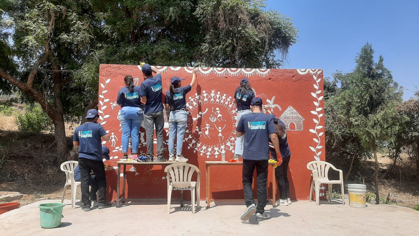 Corporate employee engagement activity where volunteers painted walls at an orphanage, supporting child welfare through creative murals, team collaboration, and CSR-driven community impact.